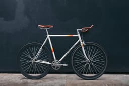 Bicycle laying on a wall
